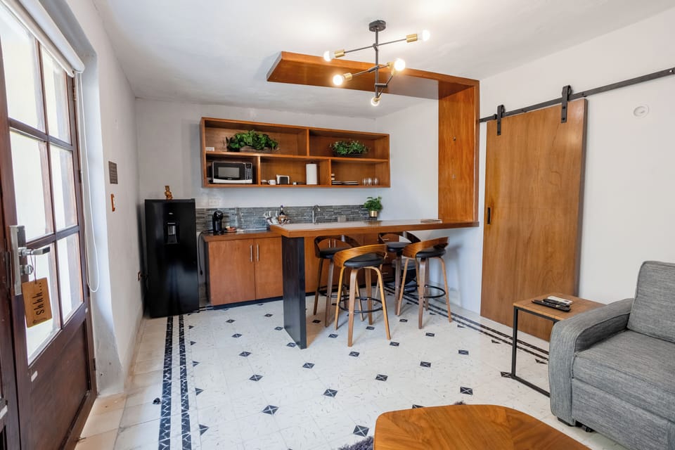 Premium Suite, 1 King Bed with Sofa bed, Refrigerator & Microwave, Pool View | Private kitchen | Espresso maker, highchair, griddle