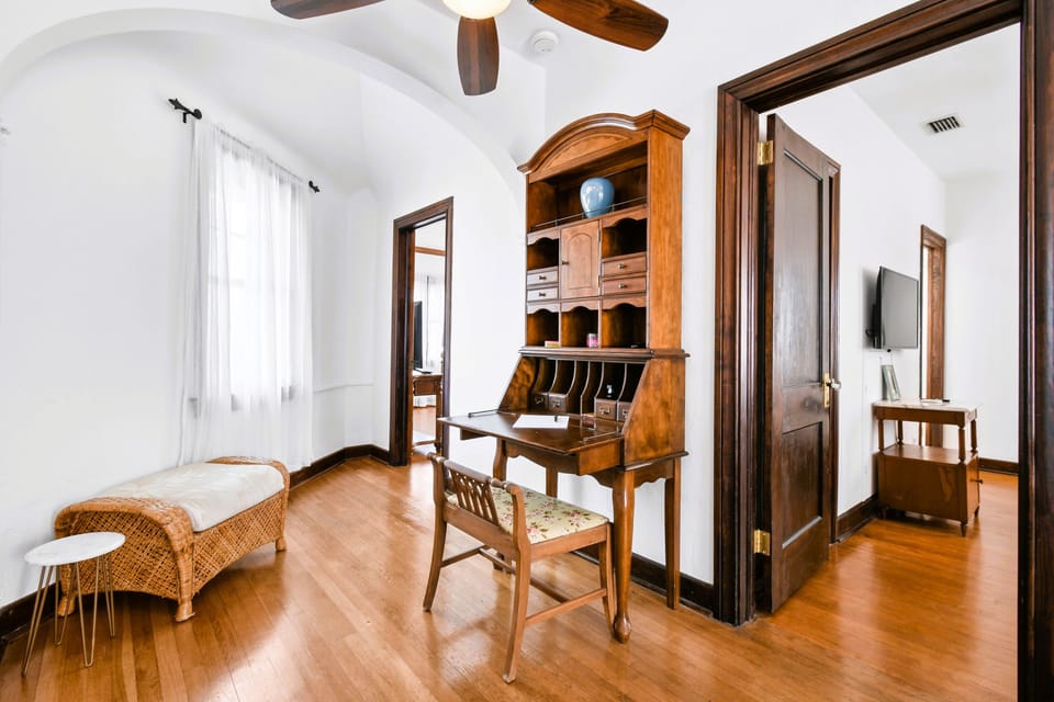 Upstairs hallway with a writing desk.