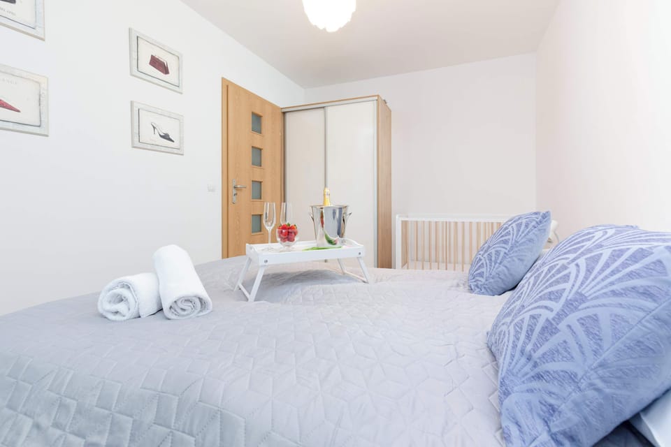 Bedroom with a comfortable double bed and wardrobe.