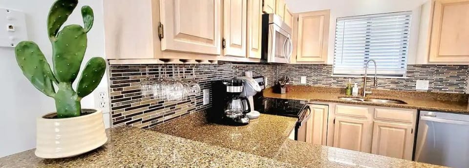 Our updated kitchen has updated granite countertops and whitewash cabinets! 