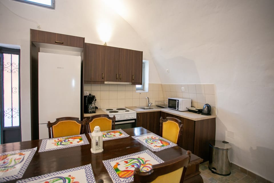 Kitchen and Dining area of Stone built villa for 8,Private garden,Near Beach, supermarket,Mani