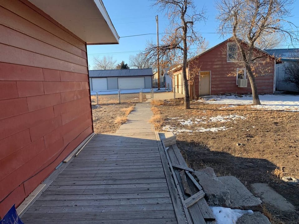 There is a large, fenced yard. Perfect for family outside time as well as letting a pet outside while you explore Thermopolis. (Please be aware that we are working on our deck, there will be a few loose boards).