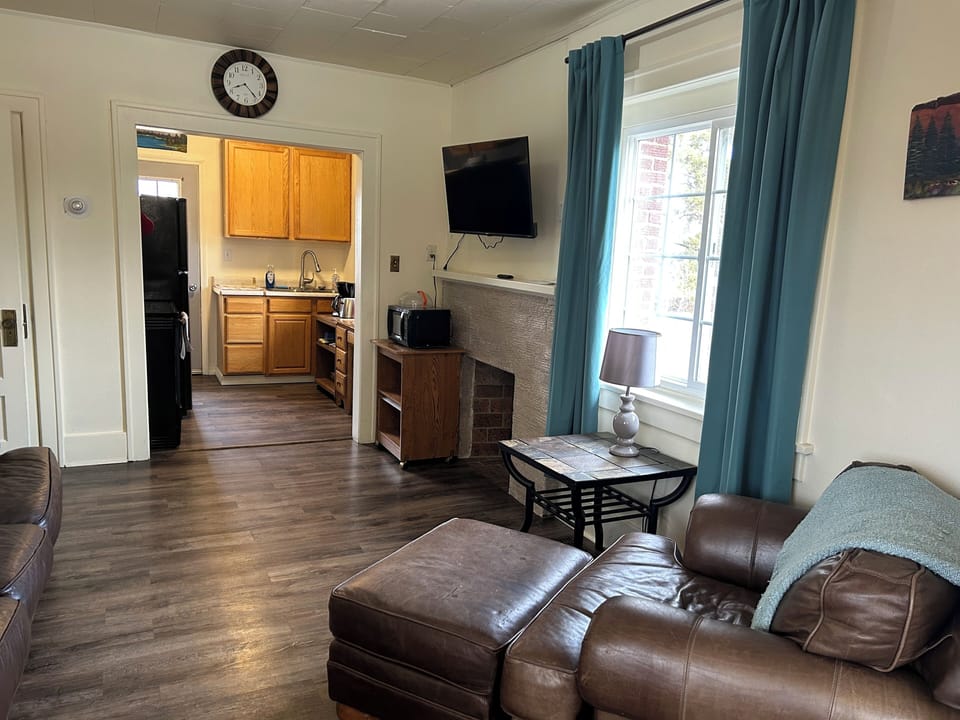 No living room is complete with out an overstuffed chair and ottoman. The living room also includes a smart TV and the house has free wifi.