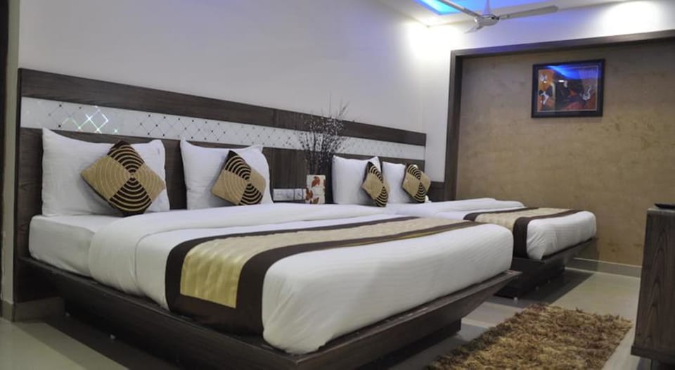 Family Double or Twin Room | Free minibar items, in-room safe, desk, iron/ironing board