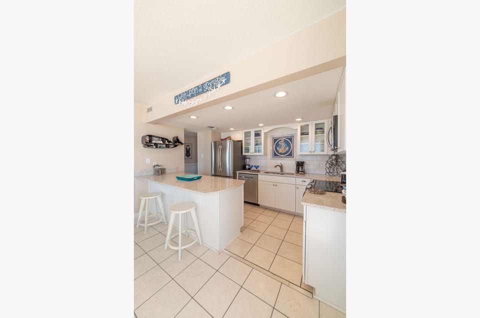 Spectacular, well equipped kitchen with a beach view, too.
