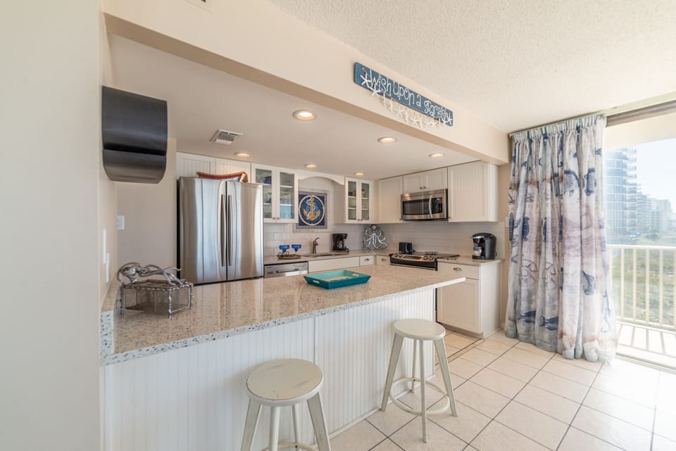 High end cabinetry, granite counter tops and stainless appliances.