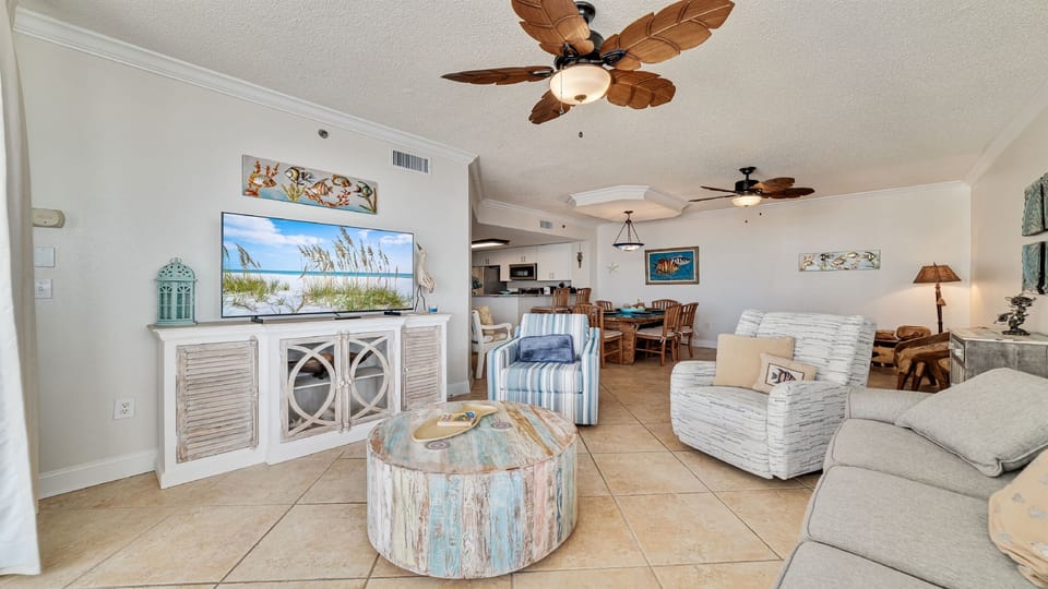 Maximize your comfort and sleeping arrangements with our versatile living area, showcasing a convenient sleeper sofa. Enjoy stunning panoramic ocean vistas right from your accommodation.