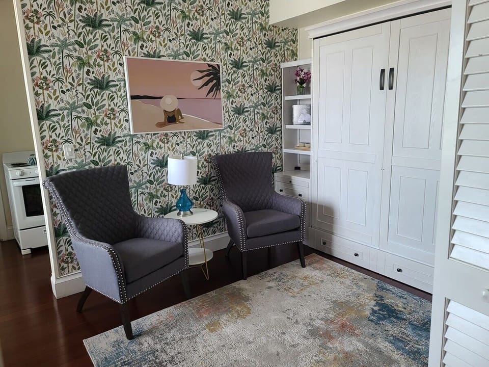 Paradise suite queen murphy bed and sitting area