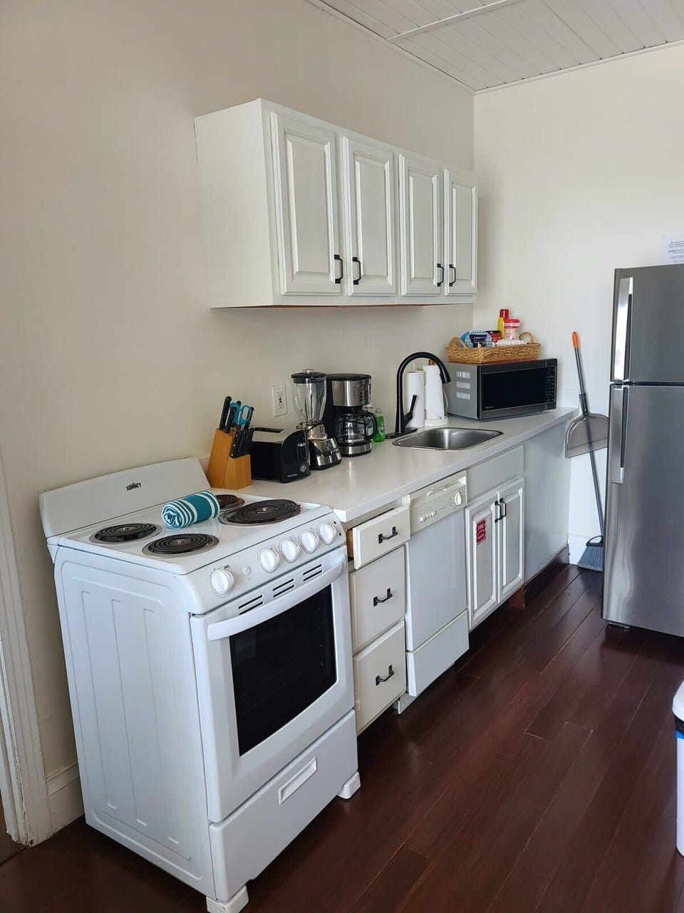 Paradise suite full kitchen with fridge, stove, over. dishwasher, microwave, blender, toaster, dinner & small plates, glasses, mugs, knives, silverware, utensils, pots, pans, coffee maker, hand soap, dish soap, paper towels, sponge