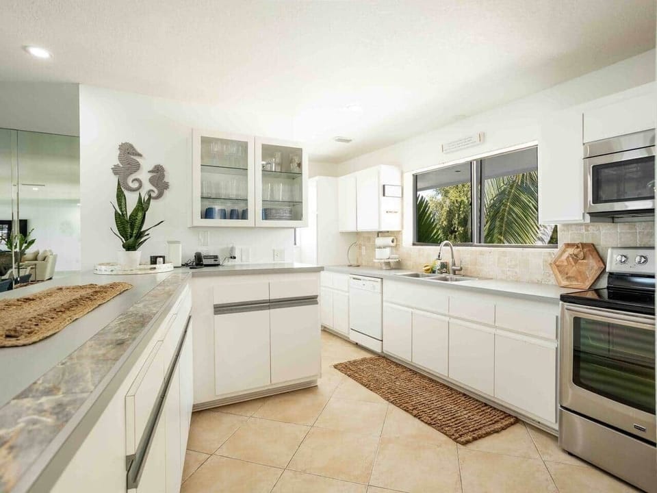 Fully equipped kitchen and adjacent laundry room