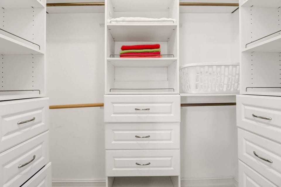 Pictured is one of two custom walk-in cosets, with ample storage space for your personal belongings during your stay.
