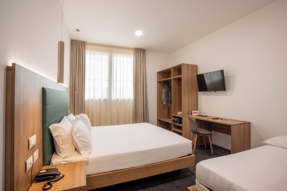 Exclusive Triple Room, Mobility Accessible | Memory foam beds, minibar, in-room safe, desk