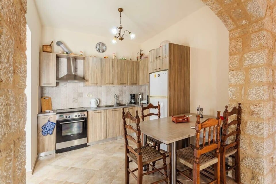 Delve into culinary adventures in the ground floor house's kitchen and dining area