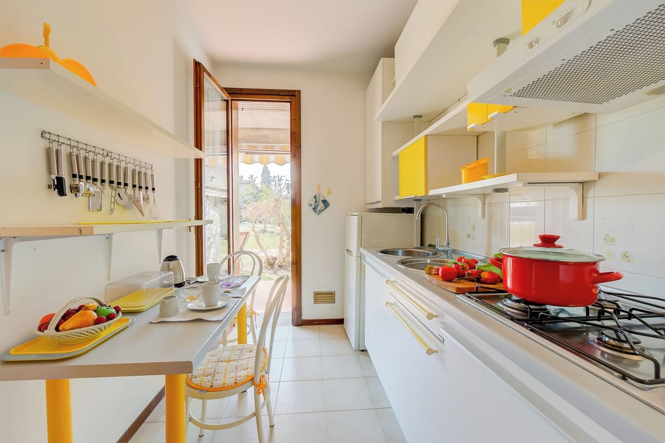 Family Apartment, Multiple Bedrooms (Cinzia Apartment Front Beach) | Private kitchen | Fridge, microwave, stovetop, coffee/tea maker