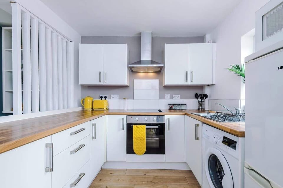 Open plan kitchen/dining area with space for 4 guests to sit down in the evenings and all the necessities to cook an array of meals after a day exploring Chester.  
