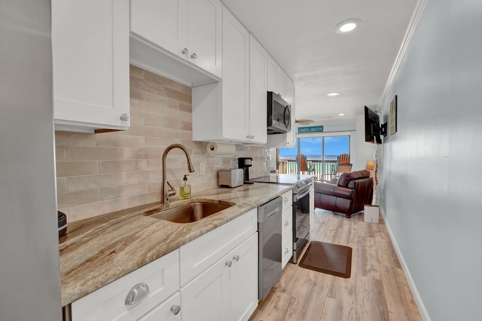 Partial Kitchen view with dishwasher and double door fridge