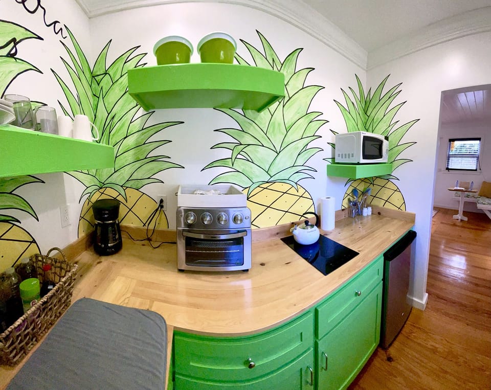 Funky groovy bright cheerful pineapple theme kitchen. Lots of stuff for cooking.