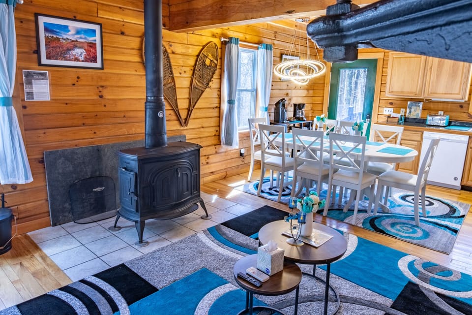Next to the living room is a modern kitchen, stocked with cooking appliances
