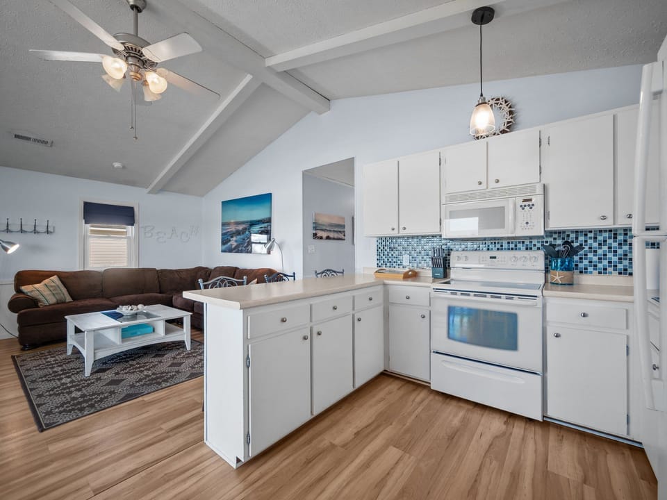 Open concept showing kitchen and living room.