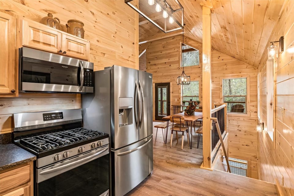 Gas range stove and large refrigerator and freezer.