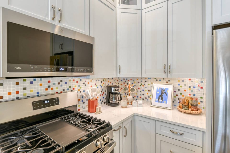 The kitchen features brand new modern appliances.