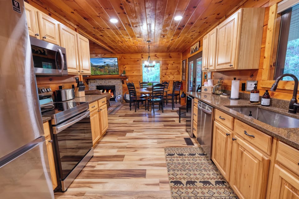 Large kitchen with quartz counter tops and upgraded, stainless steel appliances