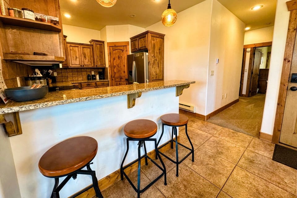 Cozy up to the bar using the stools for a morning cup of coffee or an evening nightcap. 
