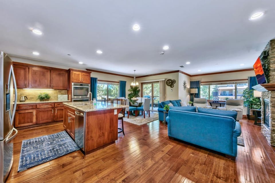 Your spacious open-concept haven features a gourmet kitchen with granite counters flowing into a cozy living area with fireplace—perfect for memorable gatherings.
