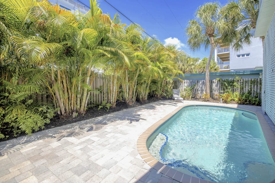 Pool with alfresco dining and lounging (shared).