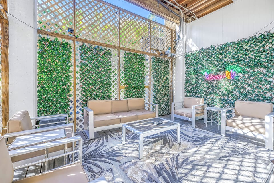 Large private patio with alfresco dining and lounging.