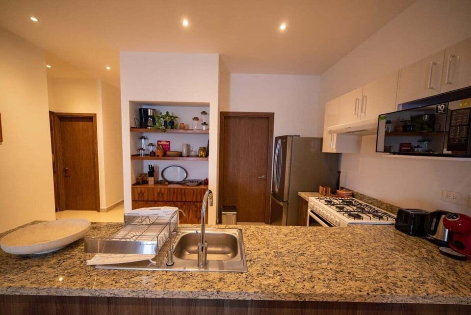 The kitchen is fully furnished and equipped with all you would need to feel at home, including a water softener and 2 coffee machines, one Dolce Gusto and one Filter Coffee.