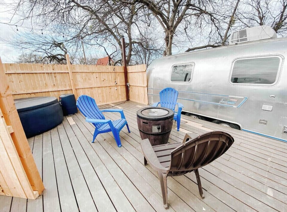 Enjoy the private deck with hot tub, fire pit and grill. 