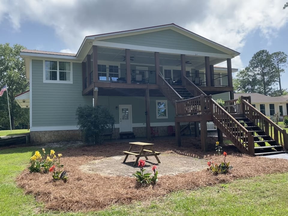Lakeside of house. Upstairs porch is perfect for dining and viewing lake!
