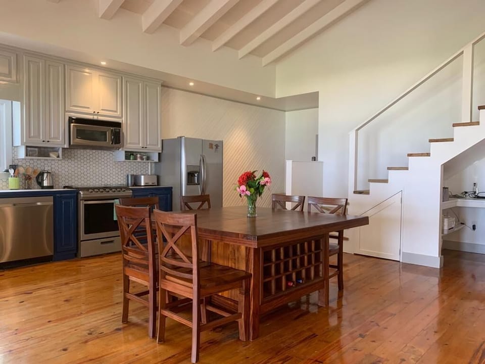 The custom dining table even includes a wine rack! 
