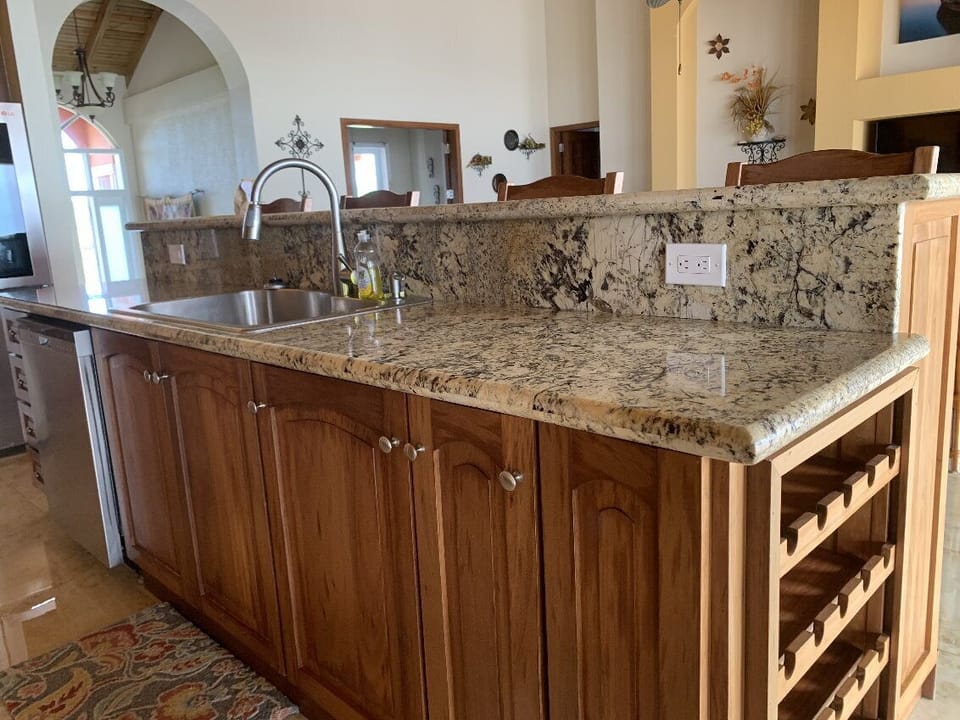 Deep basin sink and more prep areas flanked by a wine rack to add convenience 