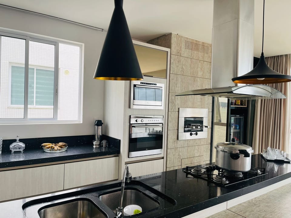 Luxury Apartment | Private kitchen | Full-size fridge, microwave, oven, toaster