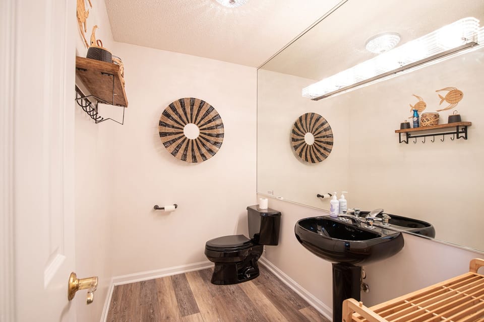 Large half bath off of the living room for convenience.