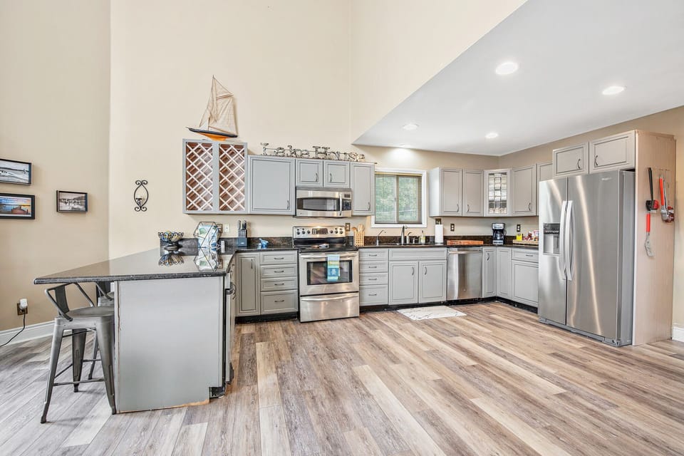 Large open fully equipped kitchen in this home provides for an easy space for everyone to get around.