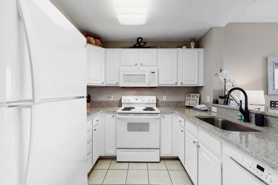 Kitchen with granite, deep sink, ice maker in freezer, quiet dishwasher