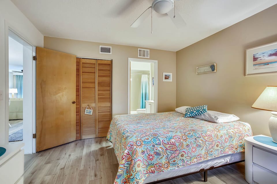 - Alternate view shows the queen bed, closet space, and nightstand with warm lighting
- Easy access to the bathroom makes this room both functional and comfortable
- Ideal for kids, friends, or extra guests who need a versatile setup
