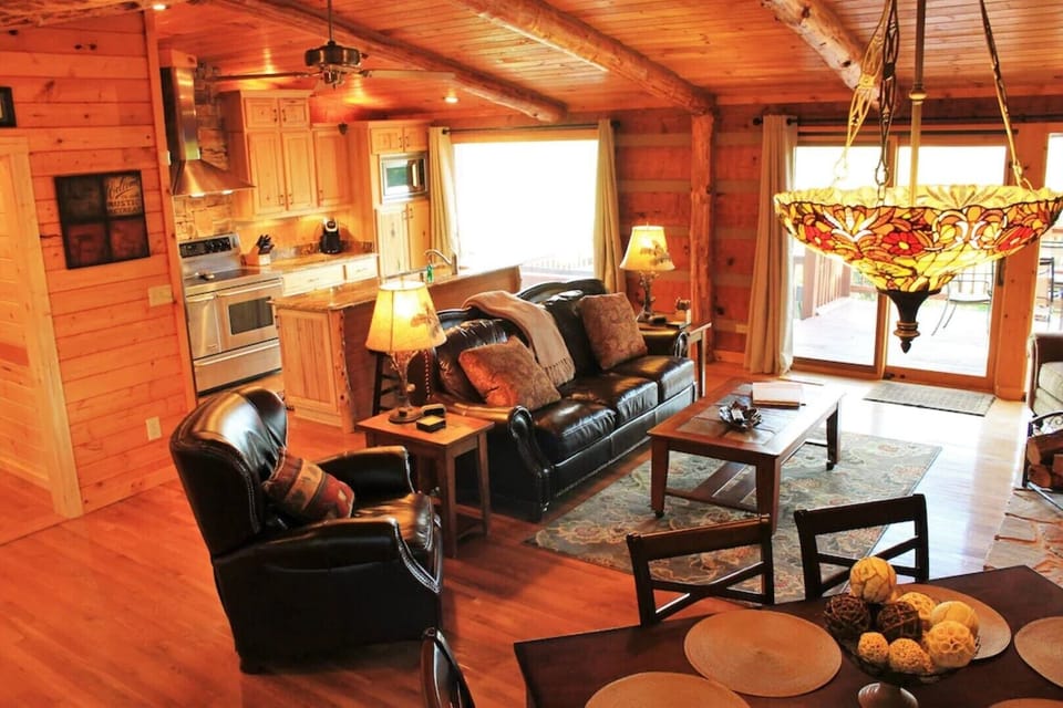 Cozy open great room with windows across the entire space to soak in the views!