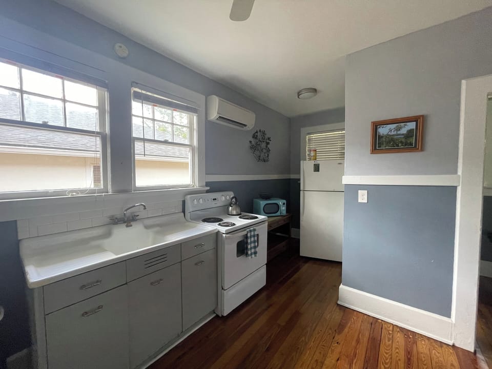 Kitchen includes stove, oven, refrigerator and microwave.