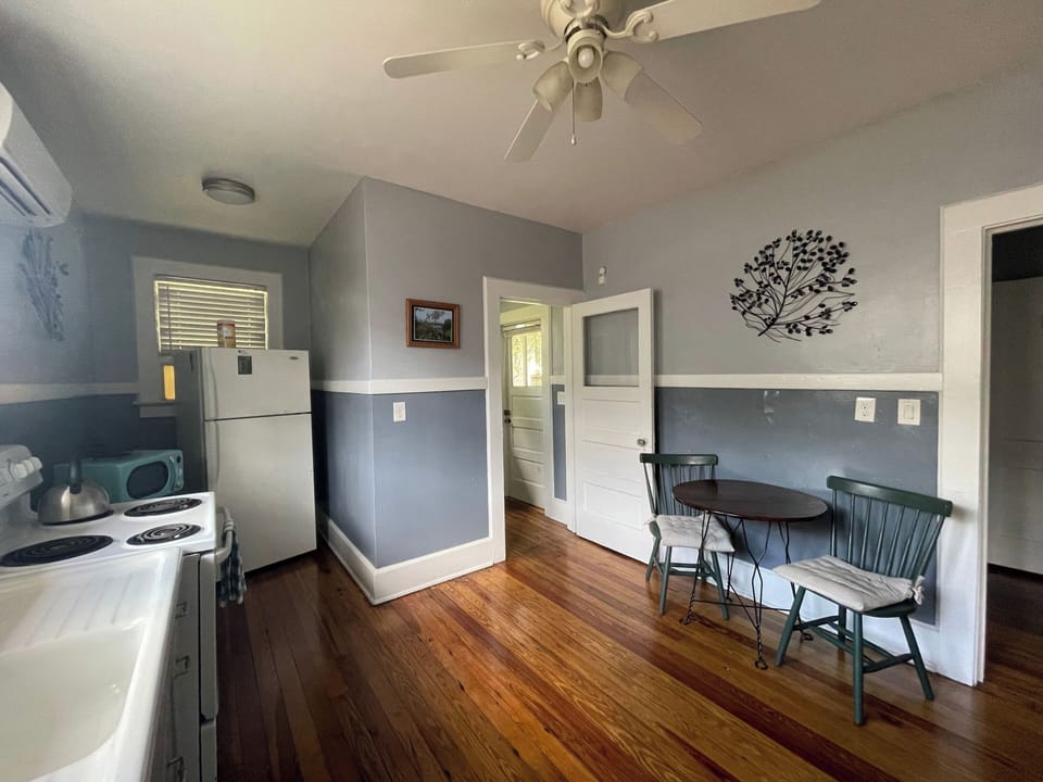 View of kitchen that shows the laundry room at the back of the home.