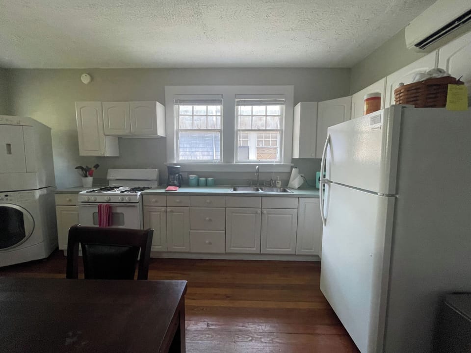 Kitchen includes gas stove and oven.  laundry room at back of kitchen