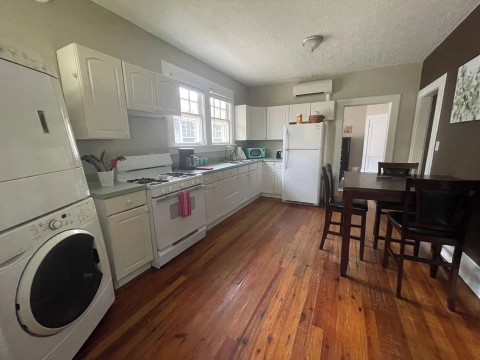 coffee maker, microwave, refrigerator, stove and oven present