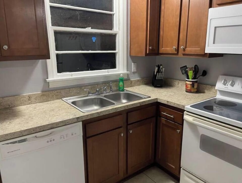 Kitchen includes oven, stove, dishwasher, fridge, coffee maker, pots and pans...