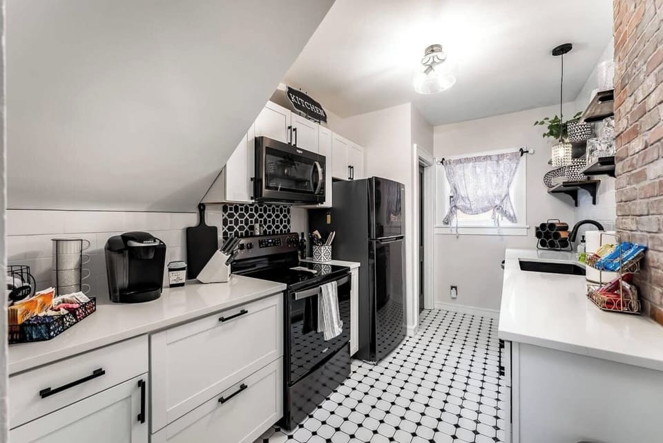 Beautifully remodeled kitchen, brand new black stainless steel appliances, open shelving and coffee bar with Keurig