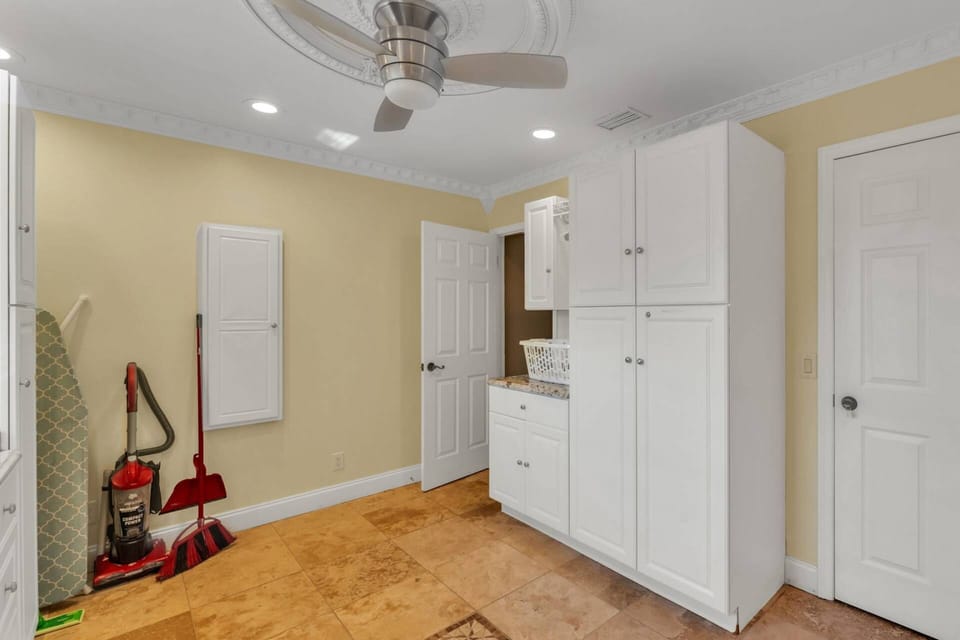 Bright, well-organized laundry area designed for convenience during longer family or group vacations.