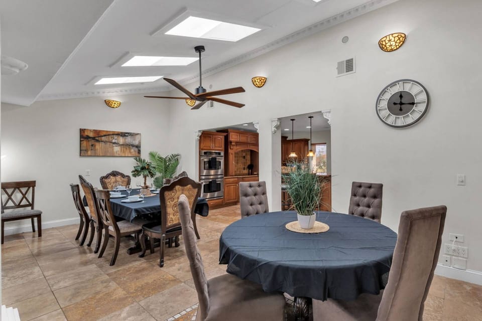 Spacious dining setup with easy access to the kitchen—perfect for hosting group dinners in this lakefront vacation rental.
