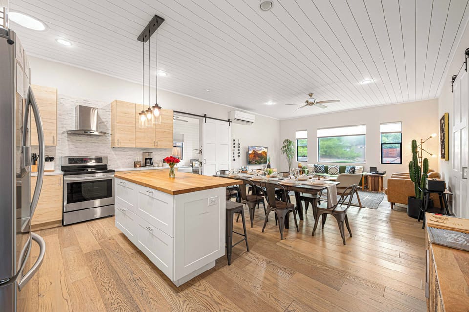 {Kitchen + Dining} The bright open-concept kitchen and dining area keeps everyone together, whether you're cooking, dining or planning the day's adventures.